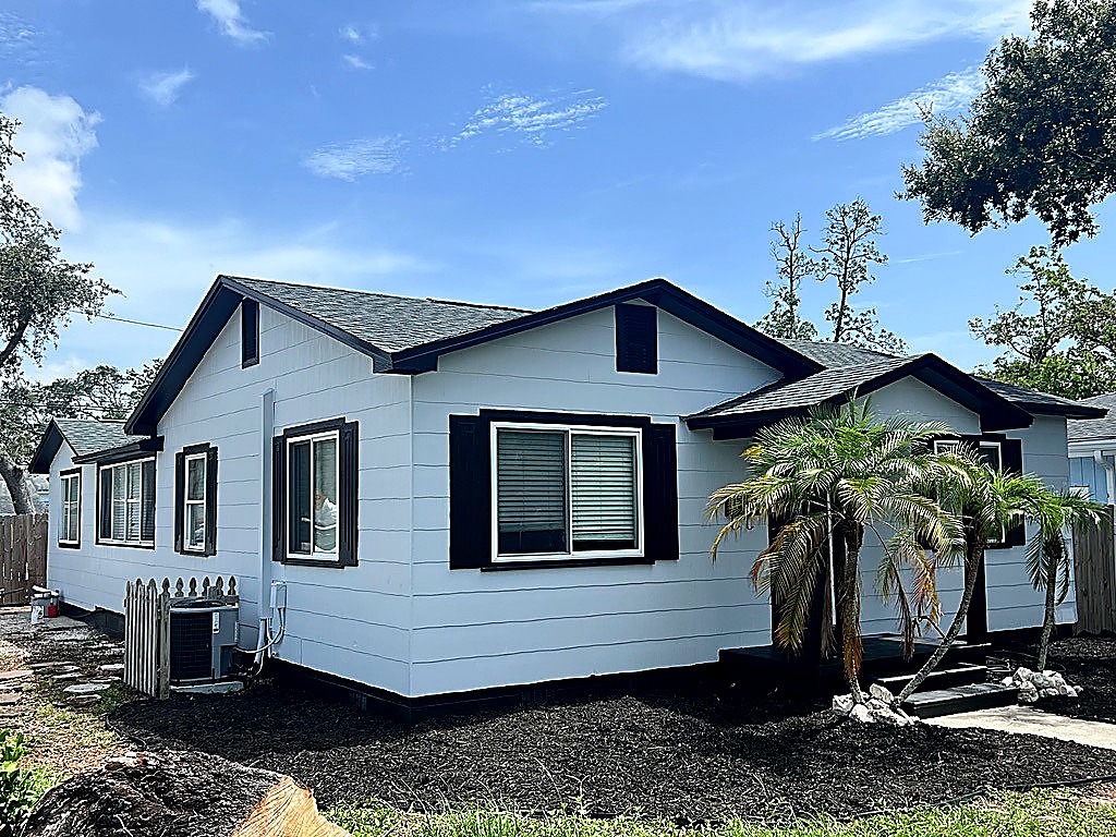 White ranch exterior with black trim and crisp edges