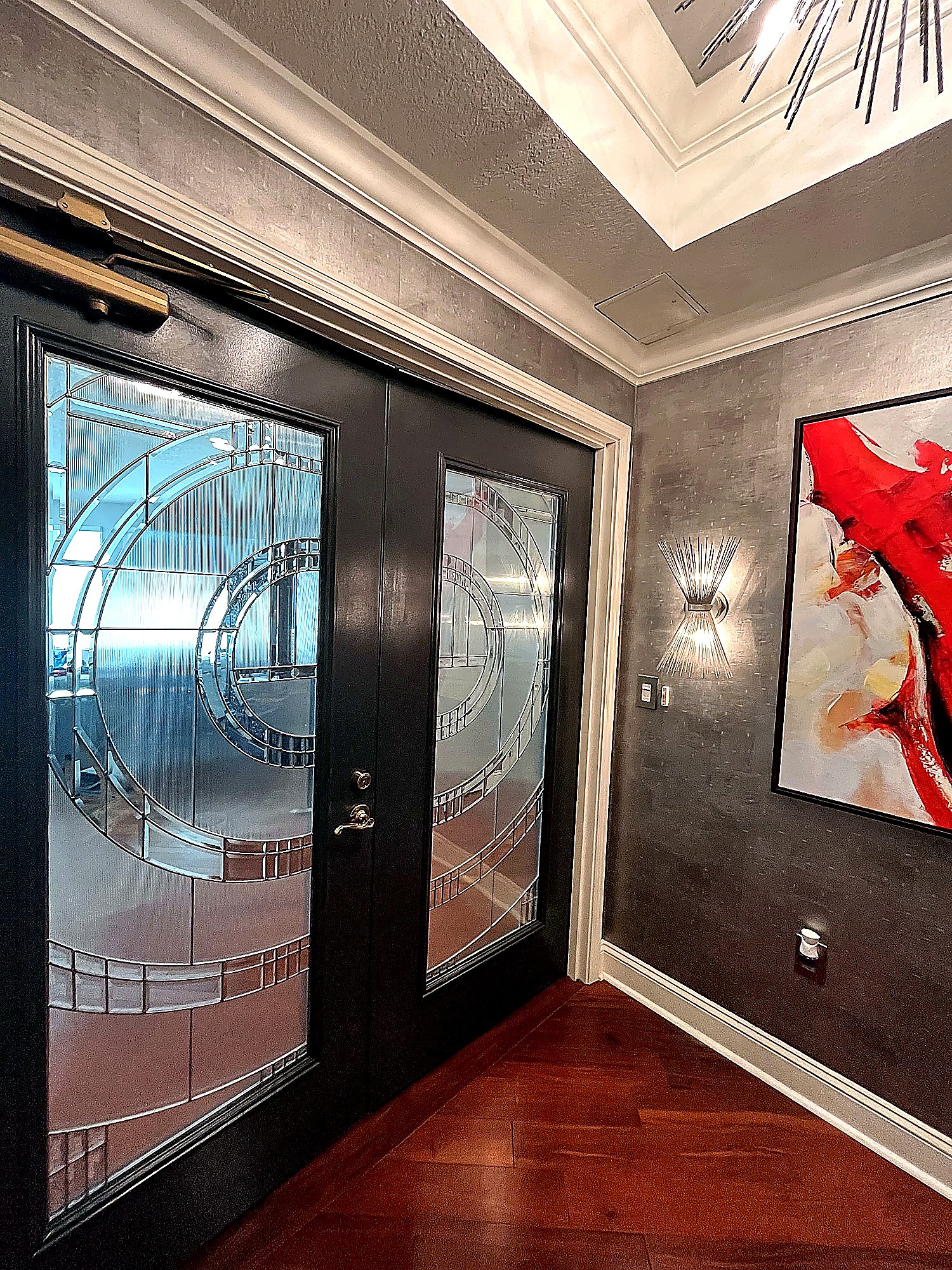 Finished foyer with art and clean painted trim